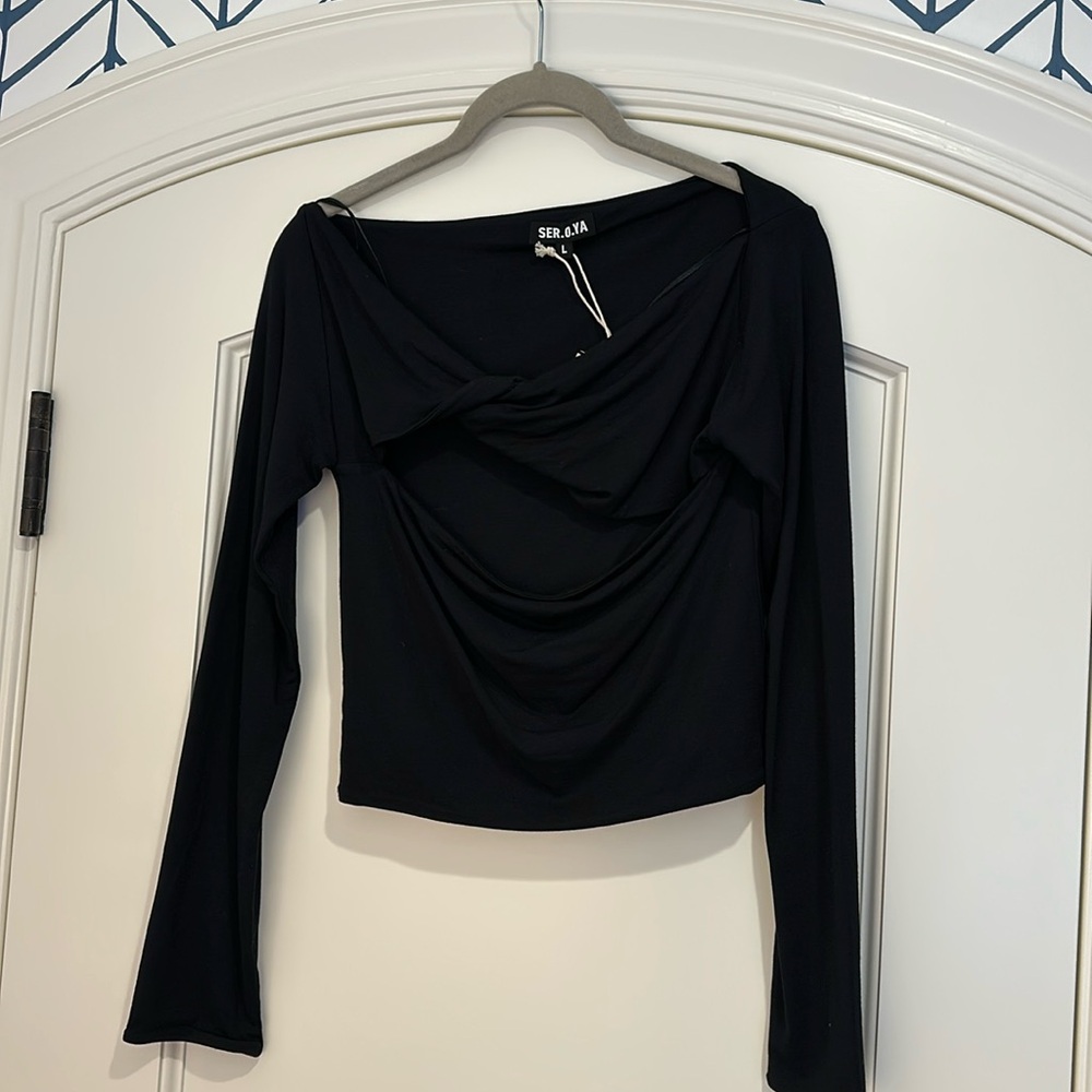 Brand new with tag. SER. O. YA. Size large black top.